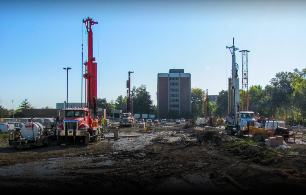 Several trucks at a drilling site
